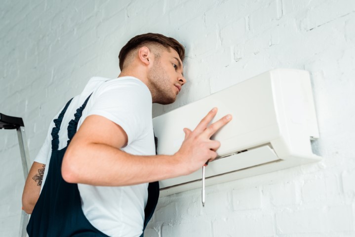 handsome worker installing air conditioner 2023 01 24 04 59 24 utc